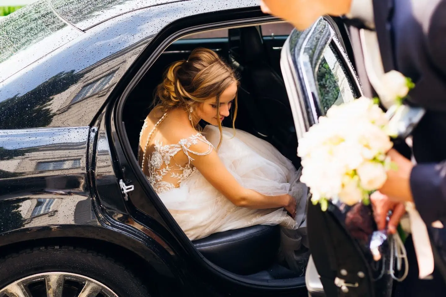 Bride stepping into a luxury wedding car in Manhattan