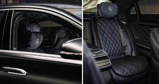 Close-up of premium quilted leather rear seating and Mercedes-Benz branded headrest for maximum passenger comfort