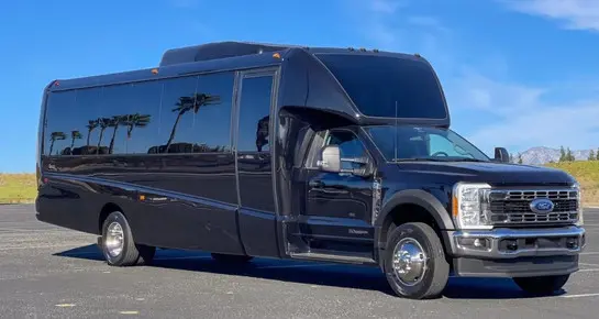 Exterior view of a luxury Ford Executive Mini Coach designed for corporate events and airport shuttle services