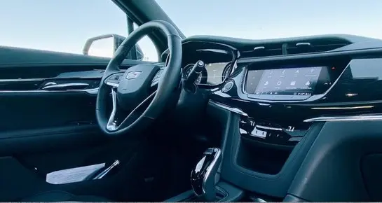 Modern Cadillac dashboard and infotainment system featuring advanced navigation for reliable chauffeur service