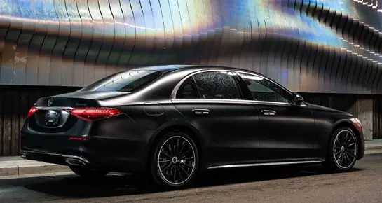 Rear view of a sleek black Mercedes-Benz S-Class sedan for premium executive transport