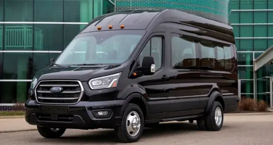 Side profile of a black Ford Transit passenger van ideal for corporate events and airport shuttle service