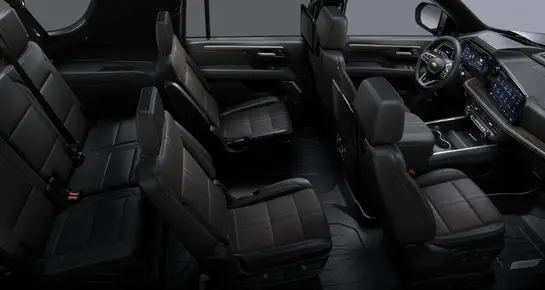 Spacious three-row leather interior of a luxury Suburban SUV with ample legroom for 7 passengers
